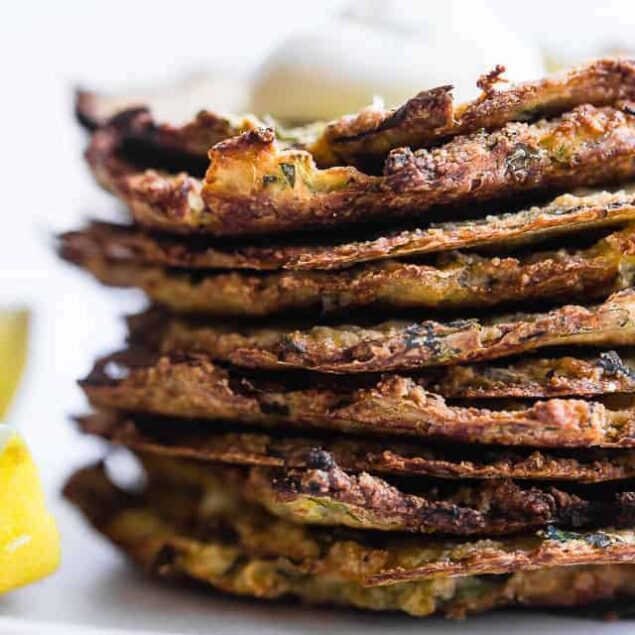 Paleo Baked Zucchini Fritters - These EAS, keto Baked Zucchini Fritters are served with an addicting lemon dill drop and are SO crispy, you'll never believe they're baked not fried! Gluten free, low carb, whole30 and insanely tasty! | #Foodfaithfitness | #Glutenfree #keto #Paleo #Whole30 #Lowcarb