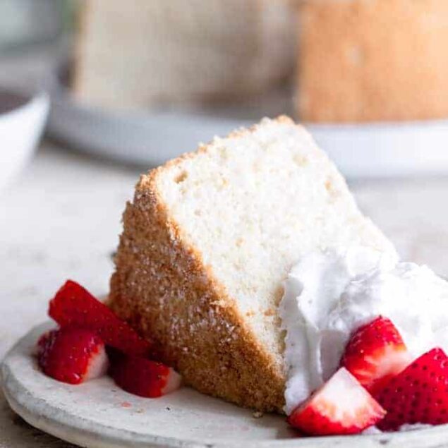 Sugar Free Angel Food Cake - This whole grain, healthy and sugar free Angel Food Cake is light, fluffy and tender! It tastes better than boxed mixes and is just as easy to make! You'll never believe it's lower carb and 50 calories! | #Foodfaithfitness | #Lowcarb #sugarfree #healthy #angelfoodcake #cake