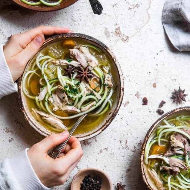 Low carb Chicken Zoodle Soup - This easy homemade healthy keto Chicken Zoodle Soup uses zucchini noodles so it's gluten free, low carb, paleo, whole30 AND packed with protein! You won't miss the noodles! | #Foodfaithfitness | #Glutenfree #Lowcarb #Keto #Whole30 #Paleo