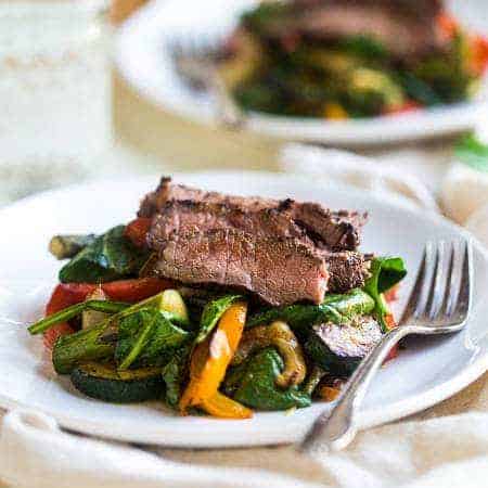 Paleo Grilled Beef Stir Fry with Asian Almond Dressing- Beef and veggies are grilled and then tossed with a creamy Asian almond butter vinaigrette and spinach for a quick and easy, healthy, Paleo-friendly meal! | Foodfaithfitness.com | @FoodFaithFit