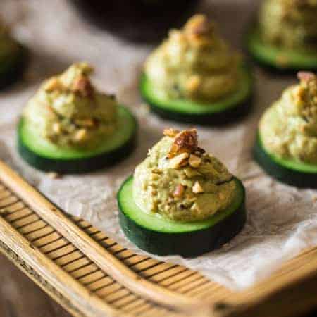 Low Carb California Roll Sushi Bites - Made of creamy Greek yogurt, avocado and crab meat and topped on a cucumber. They're a healthy, low carb and gluten free snack, or appetizer, that tastes like an California Roll, for only 40 calories! | Foodfaithfitness.com | @FoodFaithFit
