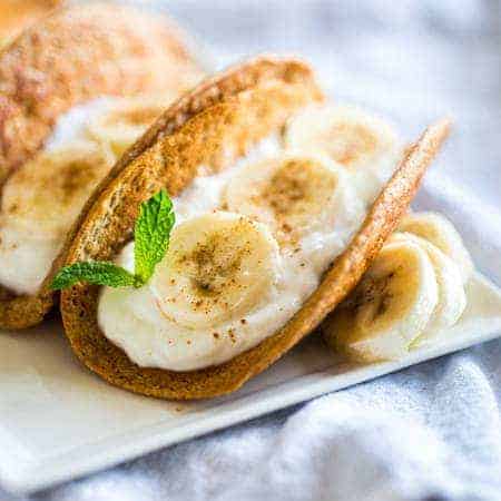 Greek Yogurt Banana Pancake Tacos - These gluten free banana pancakes are filled with Greek yogurt and rolled up like tacos! They're a fun, healthy breakfast for only 100 calories per taco! | Foodfaithfitness.com | @FoodFaithFit