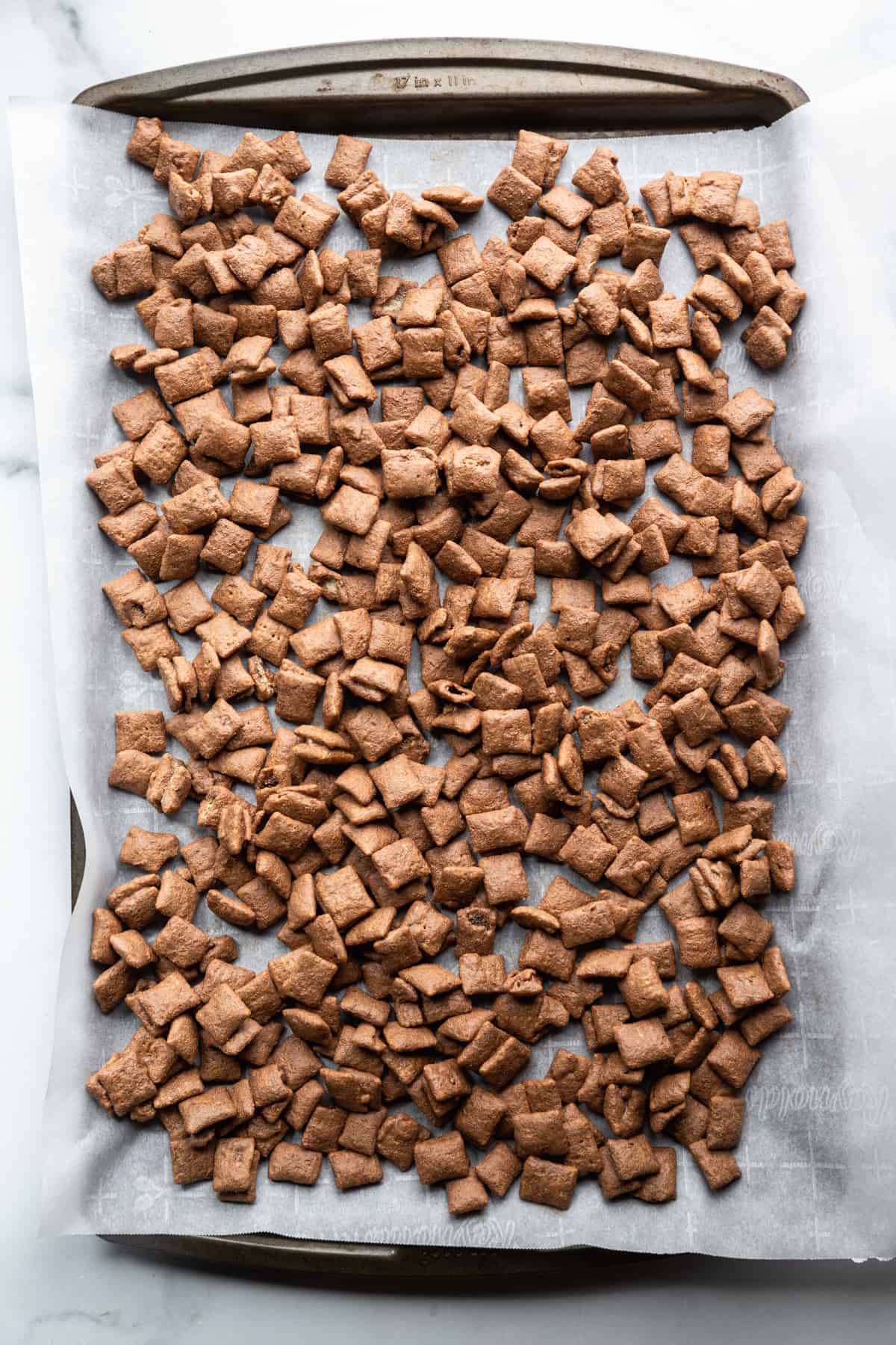Protein Puppy Chow on a baking sheet