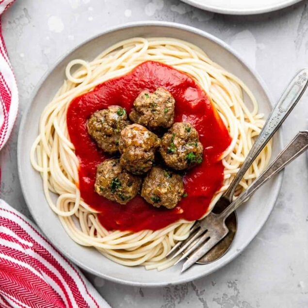 Juicy homemade meatballs served over spaghetti with marinara sauce, perfect for healthy meal prep and family dinners.