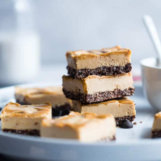 Dairy and Gluten Free No Bake Peanut Butter Cheesecake Bars - A super easy dessert with a yummy, crunchy chocolate rice krispie crust. You'd never know that they are gluten free, dairy free and made with better for you ingredients! | #Foodfaithfitness | #GlutenFree #DairyFree #Healthy #Peanutbutter #NoBake