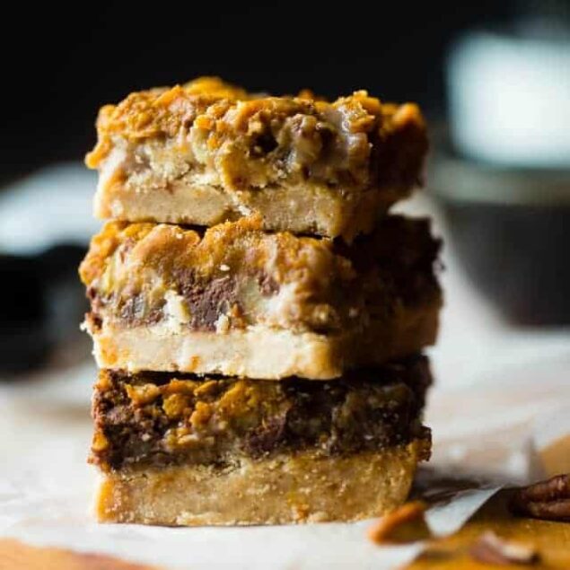 Vegan Pumpkin Spice Paleo Magic Cookie Bars - A healthier, dairy and gluten free version of the classic dessert that are packed with spicy-sweet fall flavors and are so easy to make! | Foodfaithfitness.com | @FoodFaithFit