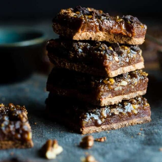 Chocolate Caramel Paleo Pecan Pie Bars - These easy paleo pecan pie bars have a layer of creamy date caramel! They're a vegan friendly and gluten free, healthier dessert for the Holidays! | Foodfaithfitness.com | @FoodFaithFit