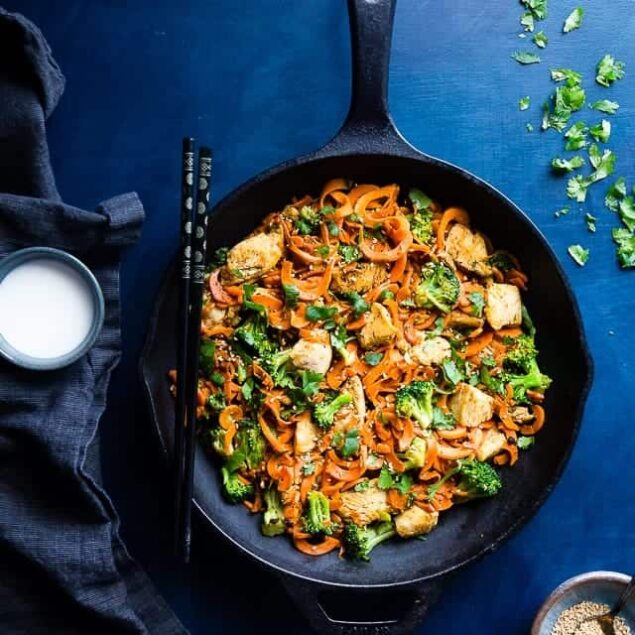 Whole30 Chicken Stir Fry with Cumin Coconut Carrot Noodles - This gluten free, low carb chicken stir fry has creamy coconut, coriander and cardamom! Add broccoli and carrot noodles for a quick and easy, paleo weeknight dinner! | Foodfaithfitness.com | @FoodFaithFit