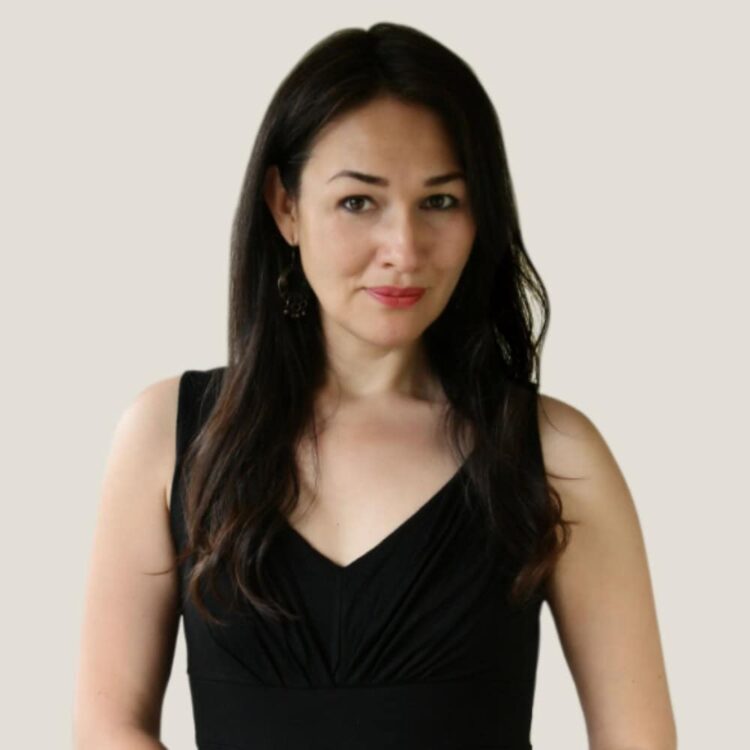 Beautiful woman with dark hair wearing a black sleeveless top, promoting healthy eating, fitness, and wellness Lifestyle.