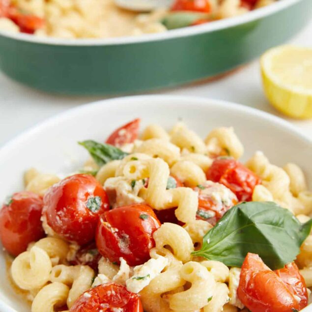 Fresh cherry tomato pasta salad with basil and feta cheese, healthy and delicious, perfect for meal prep and summer recipes.
