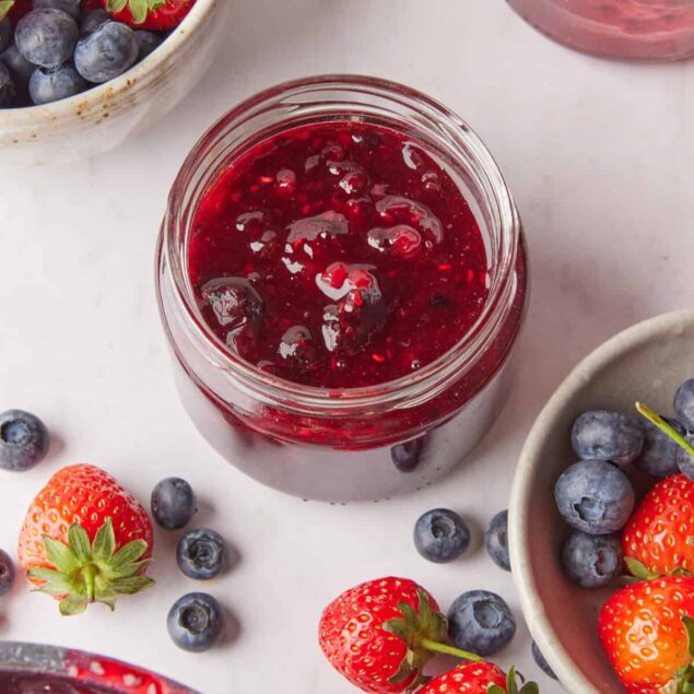 Fresh homemade berry jam with strawberries, blueberries, and raspberries, highlighting healthy eating and natural fruit-based recipes.