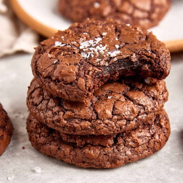 Rich, fudgy chocolate cookies topped with sea salt, perfect for healthy baking and satisfying sweet cravings. Delicious gluten-free, low-sugar treat from Food Faith Fitness.