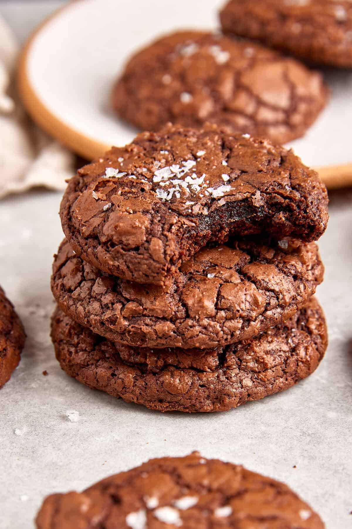 Rich, fudgy chocolate cookies topped with sea salt, perfect for healthy baking and satisfying sweet cravings. Delicious gluten-free, low-sugar treat from Food Faith Fitness.