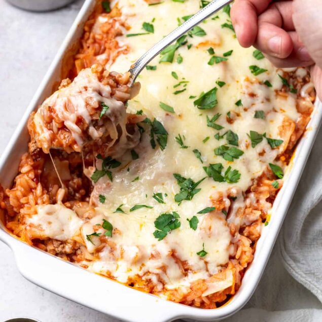 Creamy baked lasagna casserole with melted cheese and fresh herbs, healthy comfort food recipe, easy meal prep, gluten-free options, Food Faith Fitness.