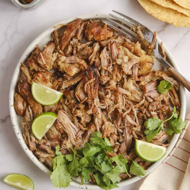 Tender shredded slow cooker pork with fresh lime and cilantro for healthy, flavorful Mexican-inspired meal options. Perfect for meal prep and family dinners.