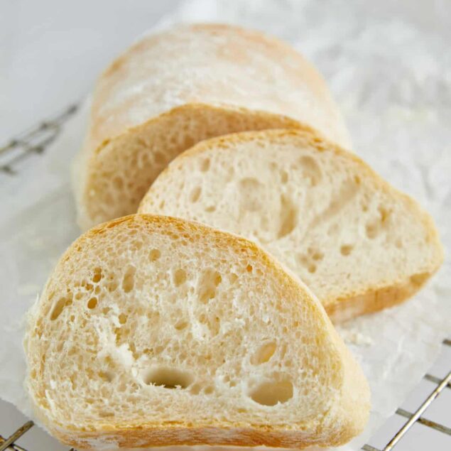 Soft Italian bread slices on a cooling rack, perfect for healthy eating and baking inspiration from Food Faith Fitness.
