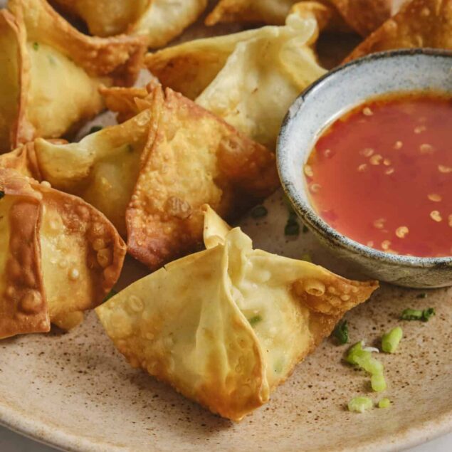 Crispy baked chicken egg rolls with sweet chili sauce, featuring fresh ingredients and healthy cooking methods. Perfect snack or appetizer from Food Faith Fitness.