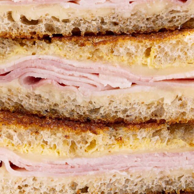 Succulent ham and cheese sandwich with toasted bread, melted cheese, and sliced ham, perfect for a quick, healthy meal or snack. Made with fresh ingredients for a satisfying flavor.