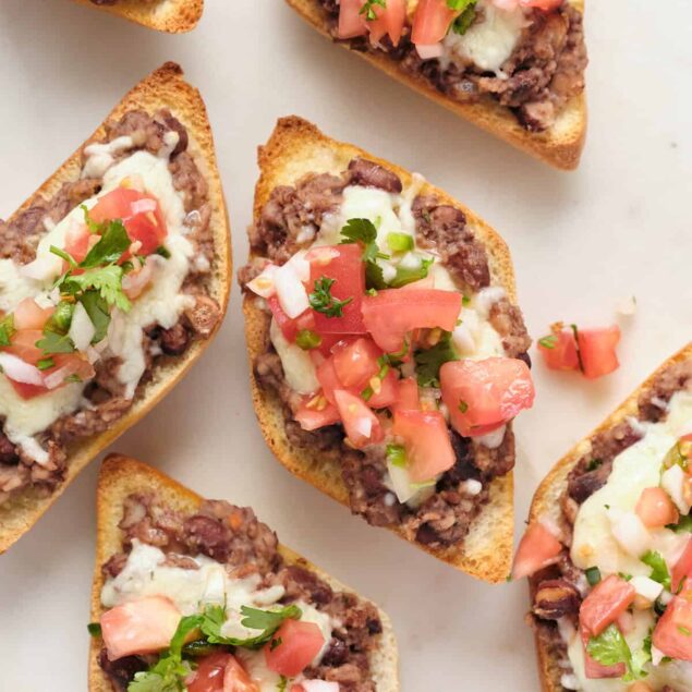 Crunchy beef taco bites with melted cheese and fresh tomato salsa, perfect for healthy meal ideas and nutritious snacks. Delicious and easy-to-make taco appetizers.