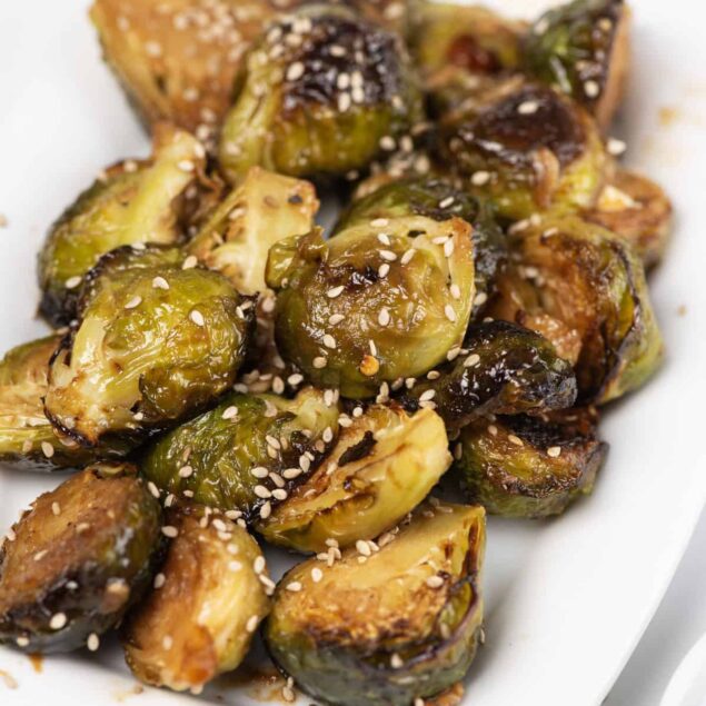 Roasted Brussels sprouts with sesame seeds, healthy vegetable side dish, perfect for meal prep and clean eating.