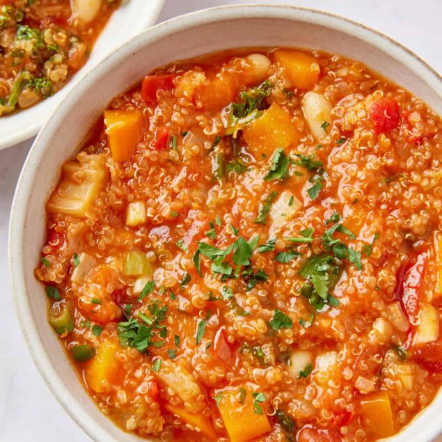 Hearty vegetable quinoa soup with fresh herbs, gluten-free, healthy vegetarian meal, high-protein vegan soup, nutritious comfort food for weight loss and clean eating.