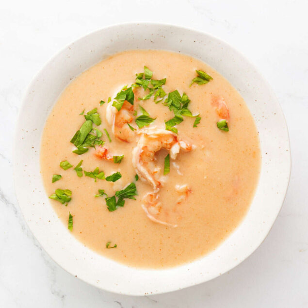 Creamy shrimp and tomato seafood chowder garnished with fresh parsley, healthy seafood recipe, nutritious soup, easy seafood meal, low-calorie comfort food, Food Faith Fitness.