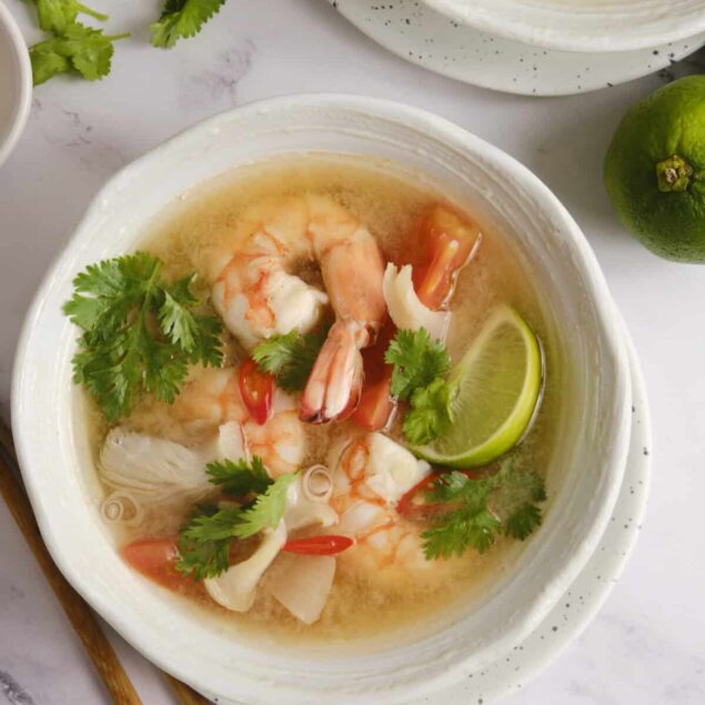 Succulent shrimp and fresh herbs in a flavorful shrimp taco soup garnished with lime wedges and cilantro. Perfect healthy recipe for seafood lovers, easy to make, and packed with vibrant flavors.