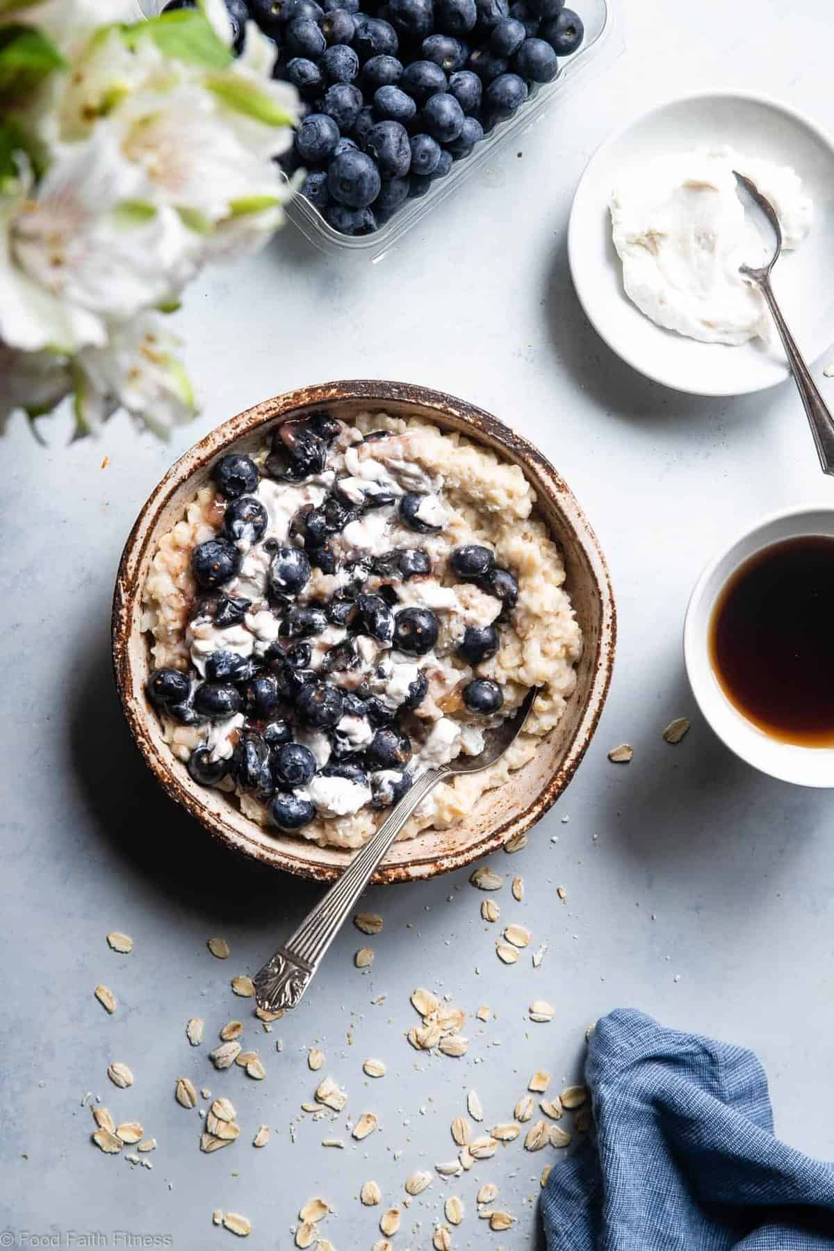 Blueberry Cheesecake Oatmeal - This quick and easy Blueberry Oatmeal with Cheesecake Swirl is a healthy, low fat and gluten free breakfast that tastes like waking up to cheesecake! | #Foodfaithfitness |