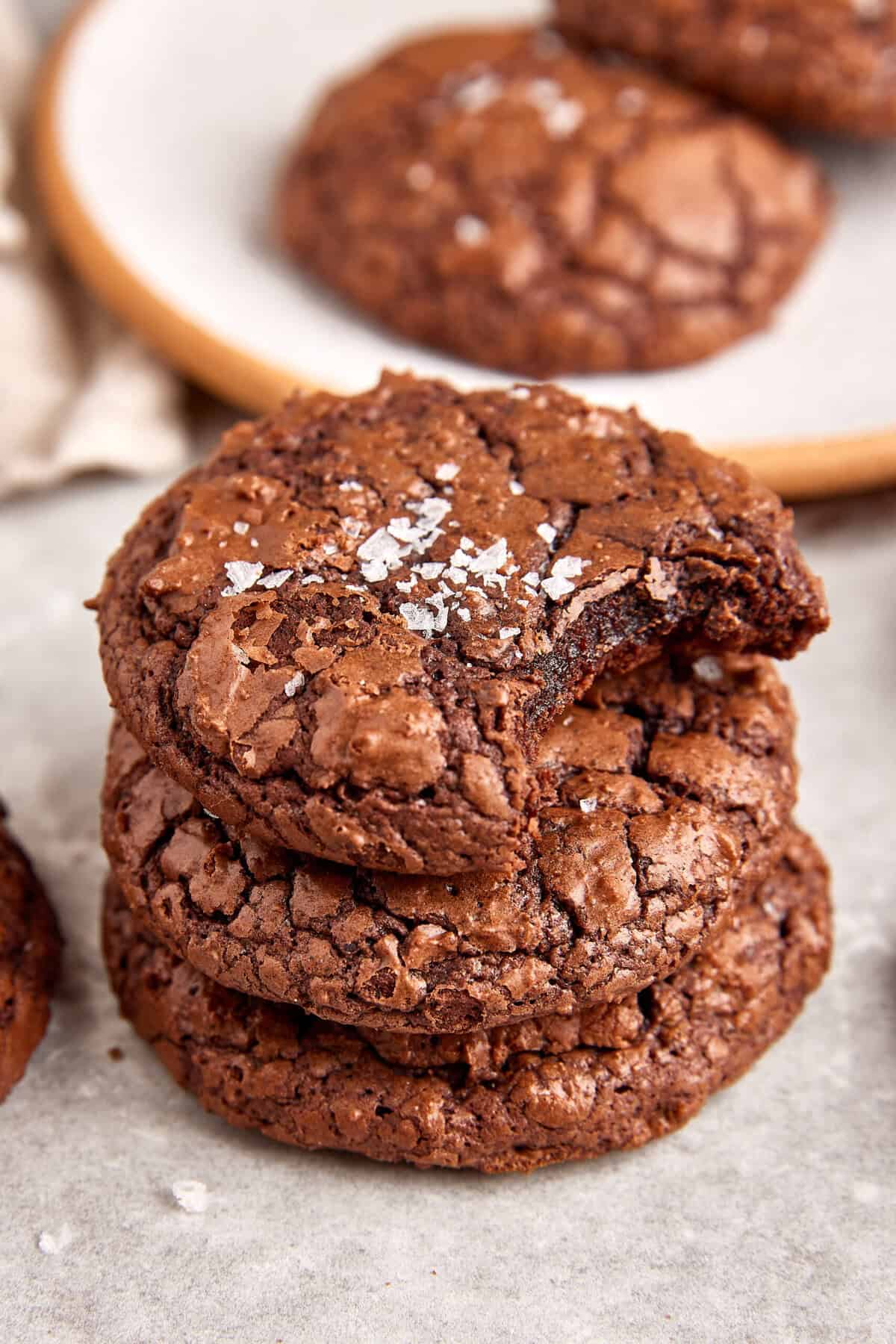 Decadent homemade triple chocolate cookies with sea salt, crispy edges, and chewy centers, perfect for chocolate lovers and easy to make with simple ingredients.