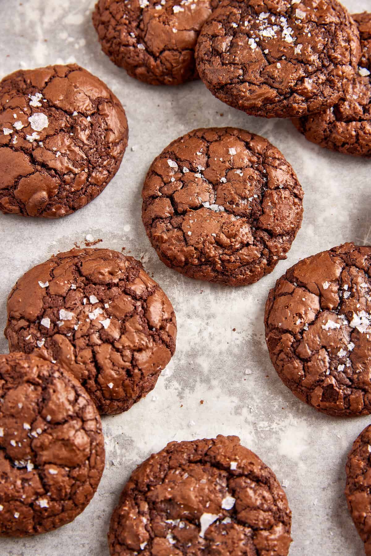 Decadent chocolate cookies with flaky sea salt on top, perfect for healthy dessert recipes and indulgent treats.