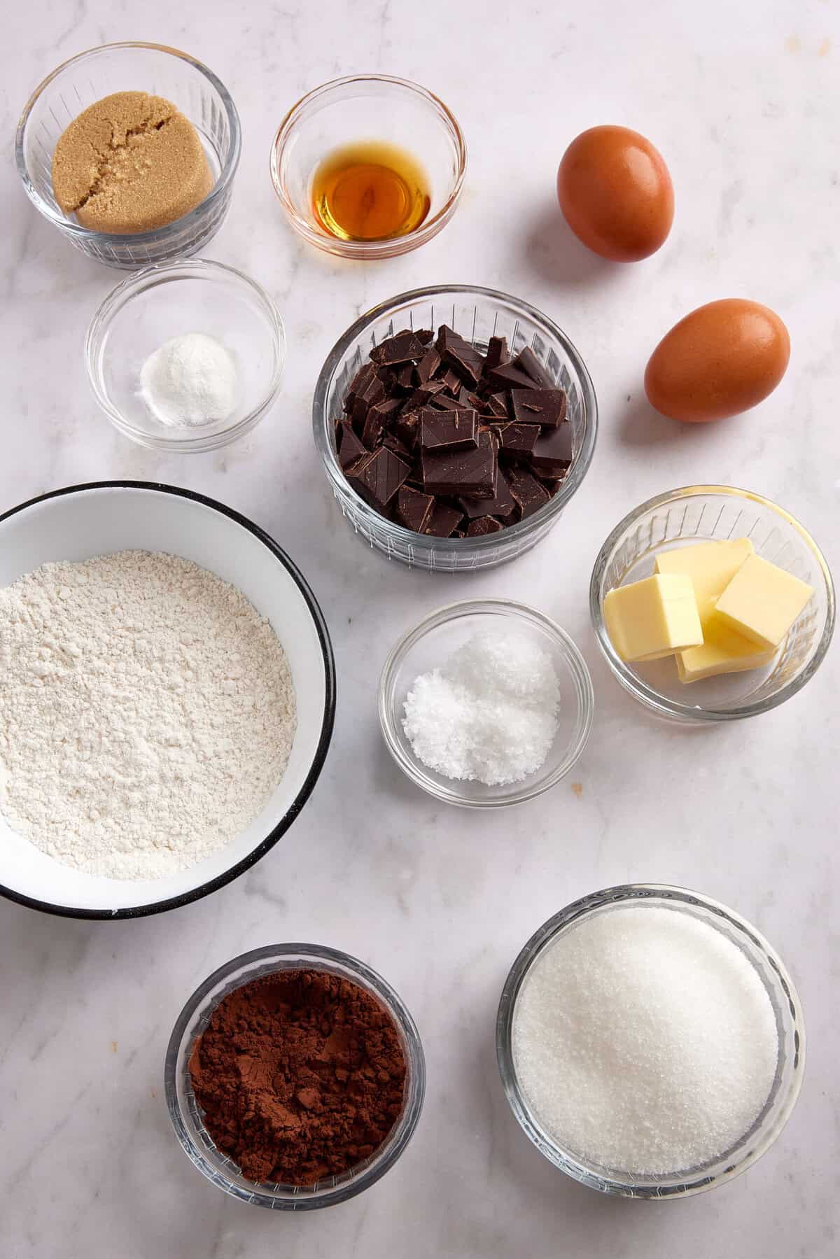 Butter, eggs, brown sugar, vanilla extract, dark chocolate chunks, flour, salt, cocoa powder, granulated sugar, confectioners' sugar, baking powder for healthy baking recipes from Food Faith Fitness.