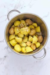 Boiled baby potatoes with herbs in a stainless steel pot, healthy side dish, nutritious, simple, delicious recipe for a balanced diet, food, vegan, vegetarian.