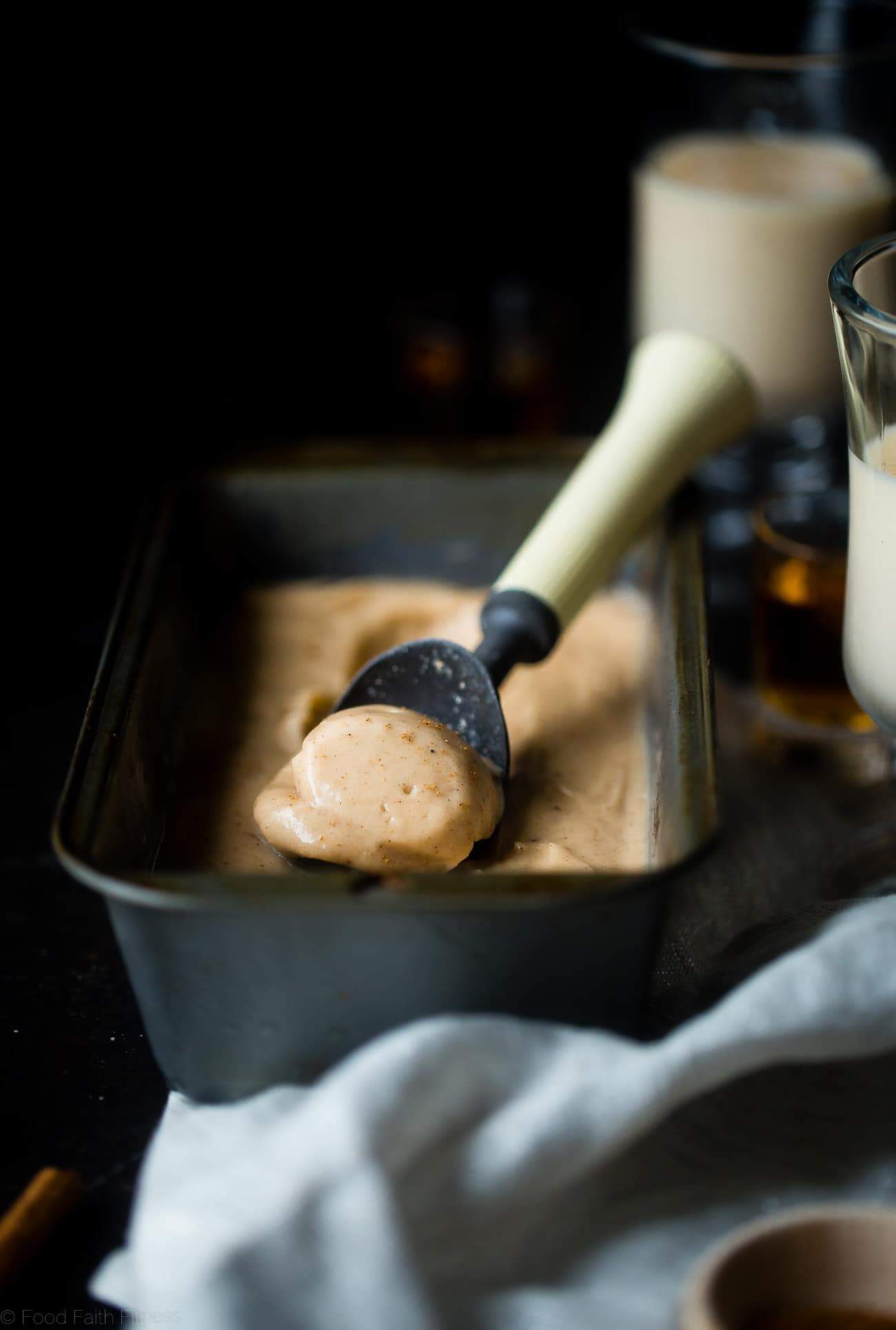 Vegan Rum and "Egg Nog" Ice Cream - This creamy, coconut milk ice cream tastes like frosty version of drinking a rum and eggnog...without the dairy or eggs! It's a healthy treat for the holidays! | Foodfaithfitness.com | @FoodFaithFit