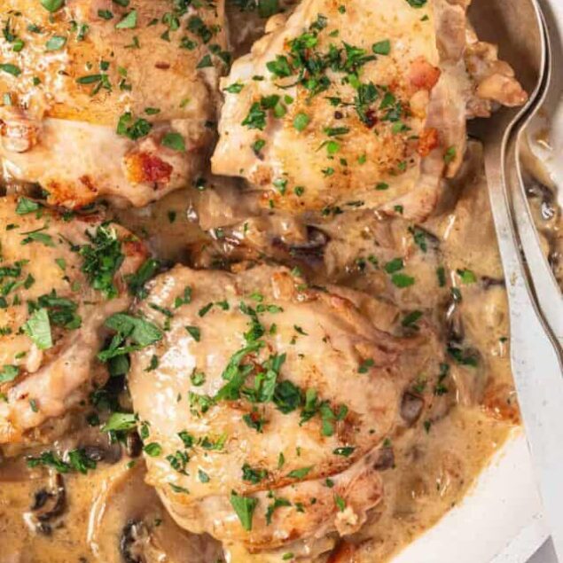 Savory chicken thighs with creamy mushroom sauce and fresh herbs, perfect for healthy eating and nutritious meals.
