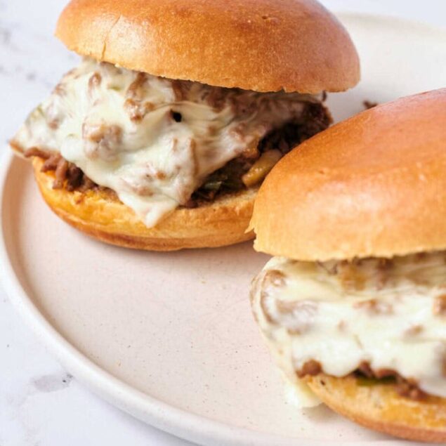 Savory cheeseburger sliders with melted cheese on soft buns, perfect for quick and delicious meals.