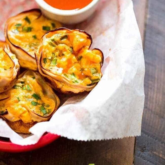 Buffalo Chicken Egg Muffin Recipe - Protein Packed and ready in 20 minutes, these are perfect for a healthy on the go breakfast or game day bite! | Foodfaithfitness.com | #recipe