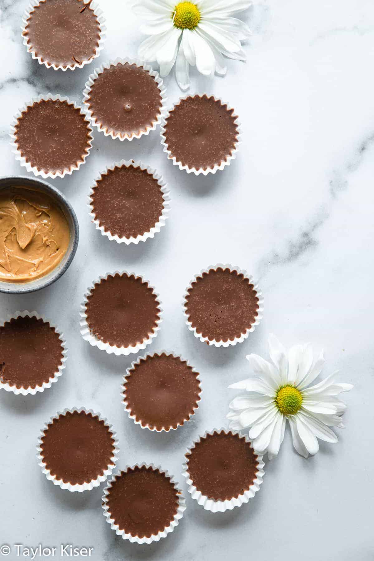 chocolate keto fat bombs on a table with flowers