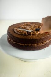 Paleo German Chocolate Cake - You'd never know this rich, moist German Chocolate Cake is a healthy remake that is paleo friendly and gluten, grain, oil, butter and refined sugar free! | Foodfaithfitness.com | @FoodFaithFit