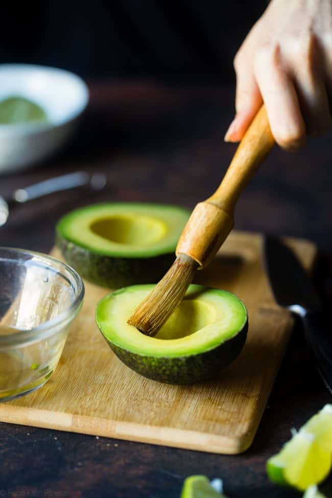 Honey Lime Grilled Avocado Shrimp Nacho Bowls - These smoky-sweet bowls have glazed honey lime grilled avocado, spicy shrimp. tomato and corn! Top them with gluten free nacho chips for a healthy, summer meal that's packed with flavor! | Foodfaithfitness.com | @FoodFaithFit