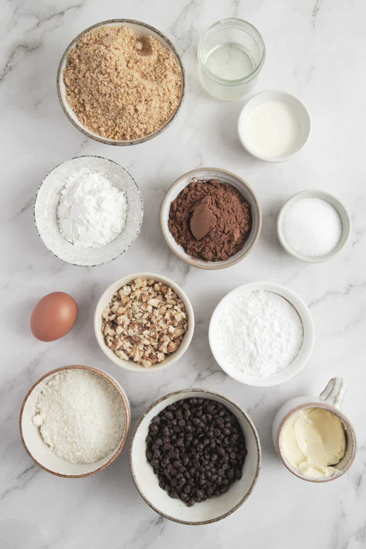 Flour, cocoa, sugar, chocolate chips, eggs, milk, and baking ingredients for healthy baking recipes on Food Faith Fitness website.