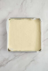 Creamy vanilla ice cream base in a square metal container, ready for freezing or mixing. Perfect for homemade healthy ice cream recipes at Food Faith Fitness.