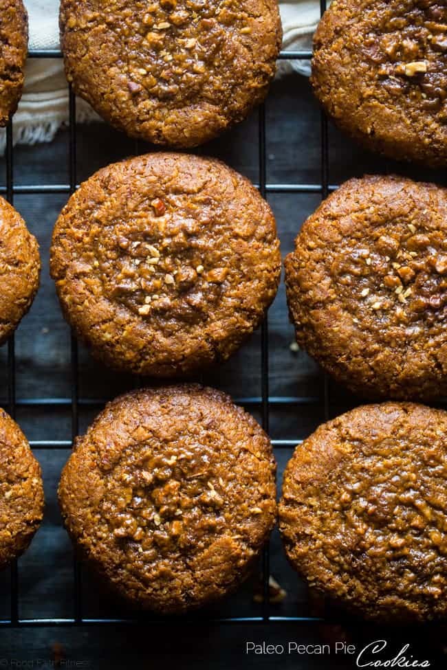 Pecan Pie Paleo Cookies - These easy cookies taste like pecan pie INSIDE a cookie because they have a sticky-sweet, crunchy pecan center! You'll never guess they're gluten free and healthier treat for the holidays! | Foodfaithfitness.com | @FoodFaithFit