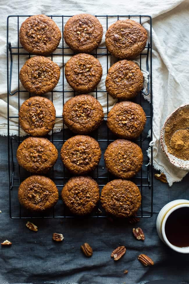 Pecan Pie Paleo Cookies - These easy cookies taste like pecan pie INSIDE a cookie because they have a sticky-sweet, crunchy pecan center! You'll never guess they're gluten free and healthier treat for the holidays! | Foodfaithfitness.com | @FoodFaithFit