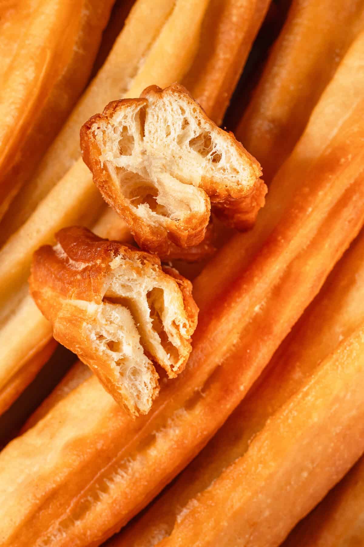 Golden crispy churros with a crunchy texture and soft interior, perfect for a healthy snack or breakfast treat. Made with simple ingredients for a delicious, guilt-free indulgence.